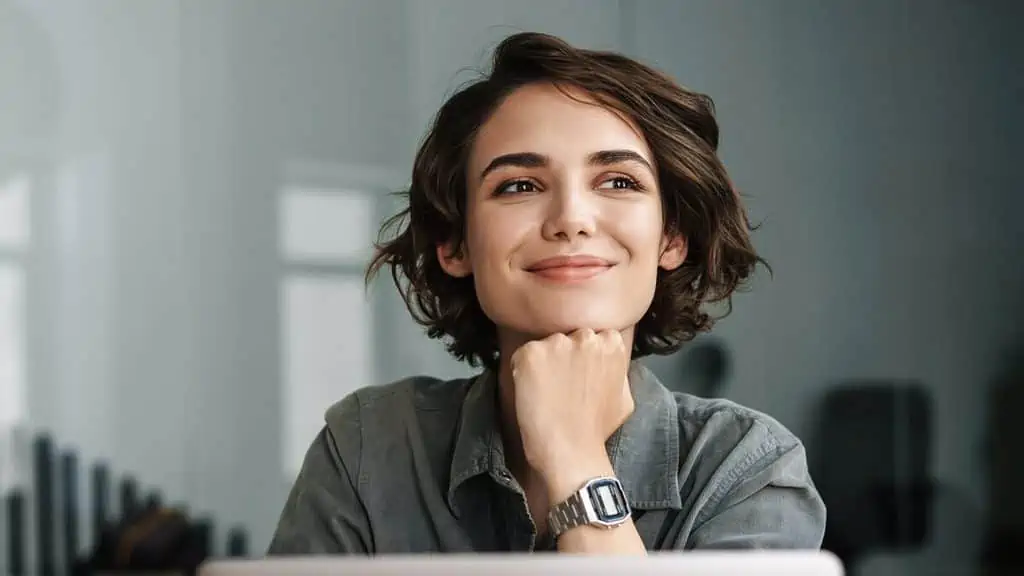woman smiling ss dean drobot scaled e1661865158899 - 10 Jobs That Will Be "Long Gone" in 10 Years - Thanks to Our AI Overlords
