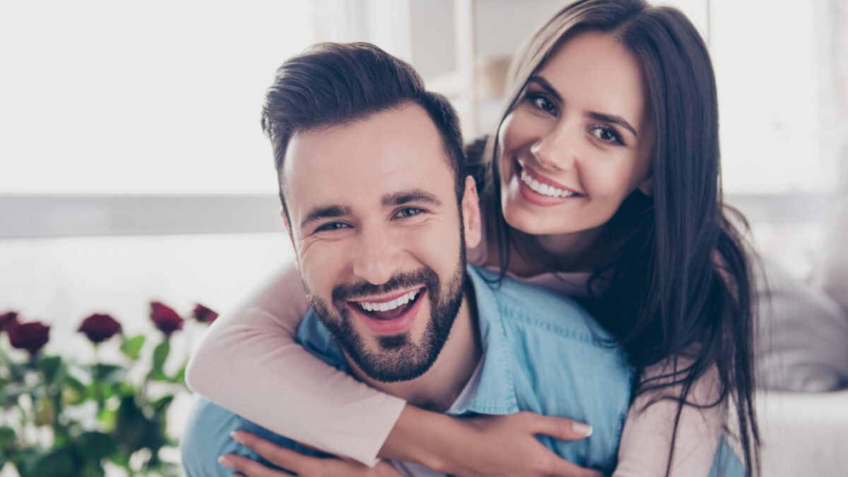 man and woman smiling, couple