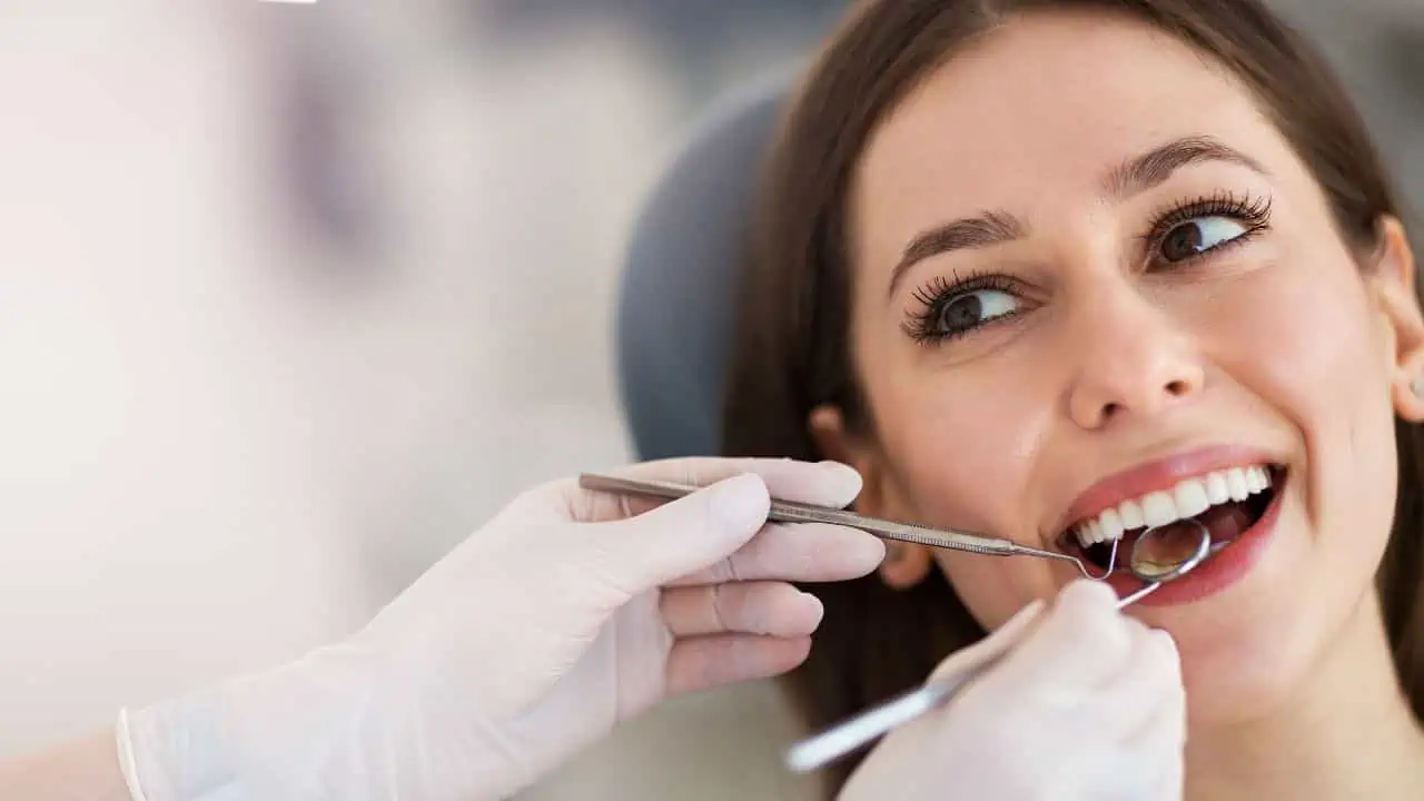 woman at dentist ss - 12 Unique Careers That Earn Six Figures or More