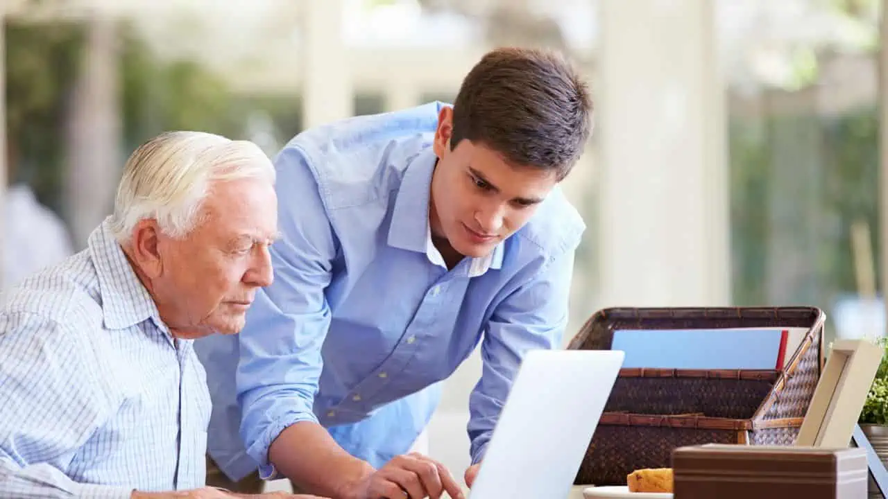 old person working ss - As Boomer Parents Age, 10 Ways You Can Help Them Manage Their Finances