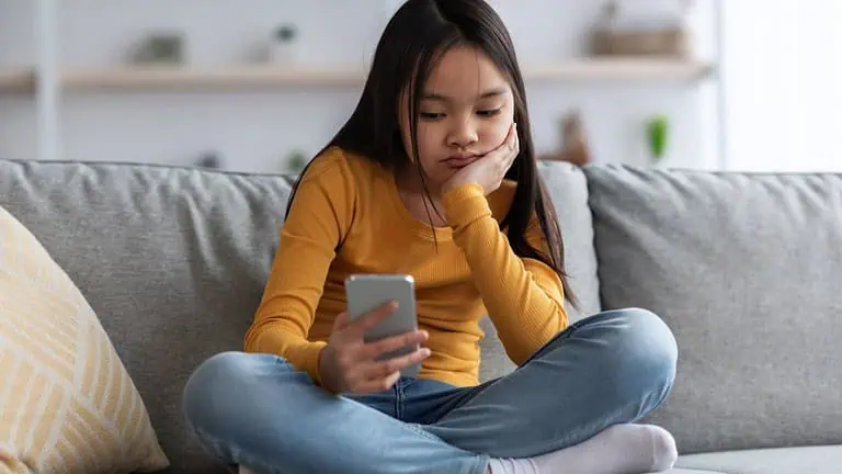 Bored kid with mobile