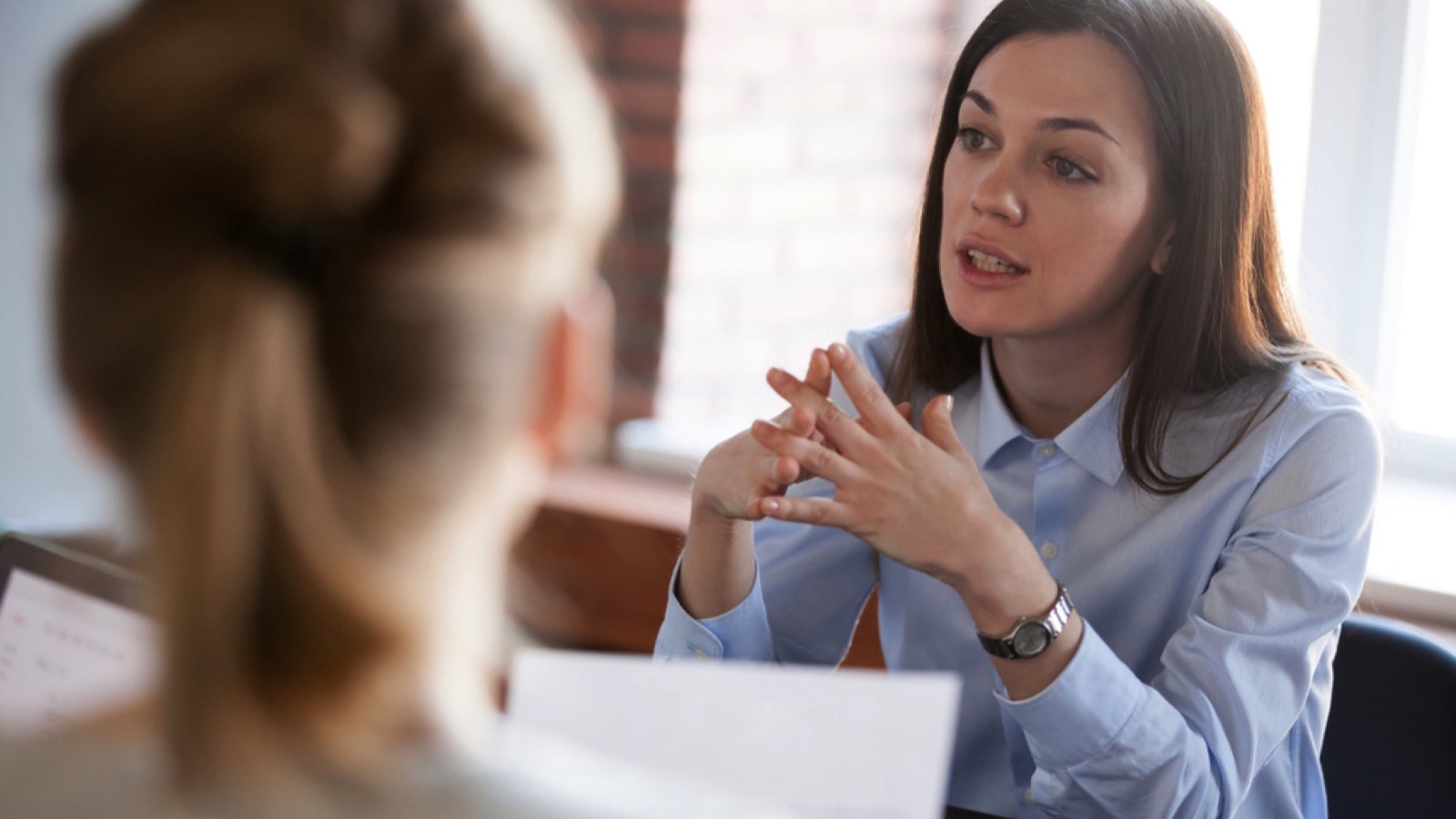 Bold woman talking to interviewer