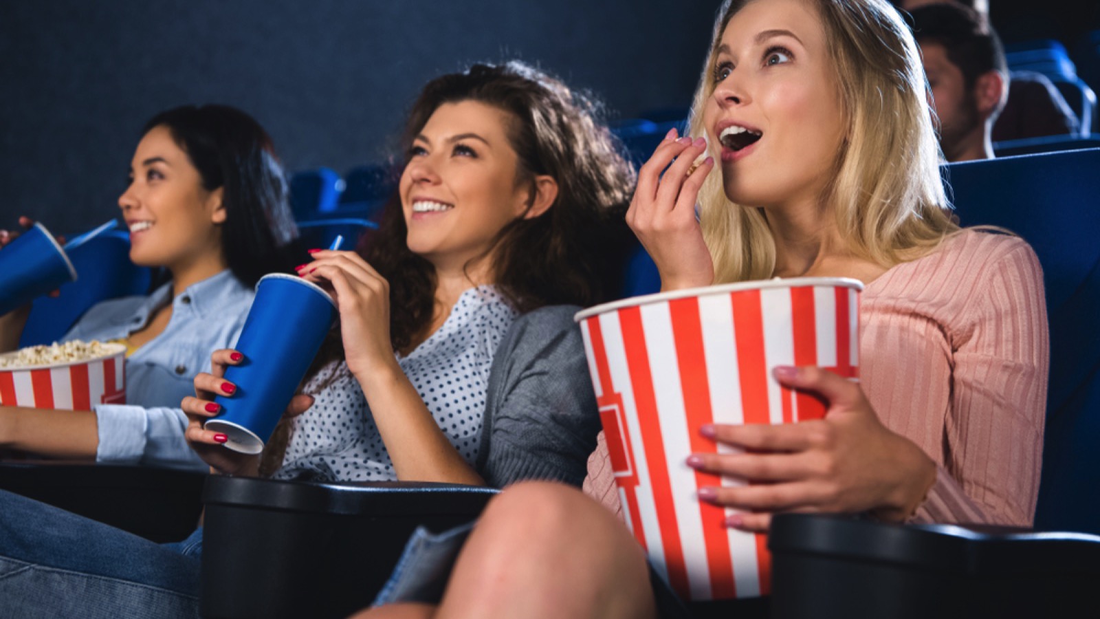 15 Things Even Broke People Always Spend Money On 6 Friends enjoying movie in theatre