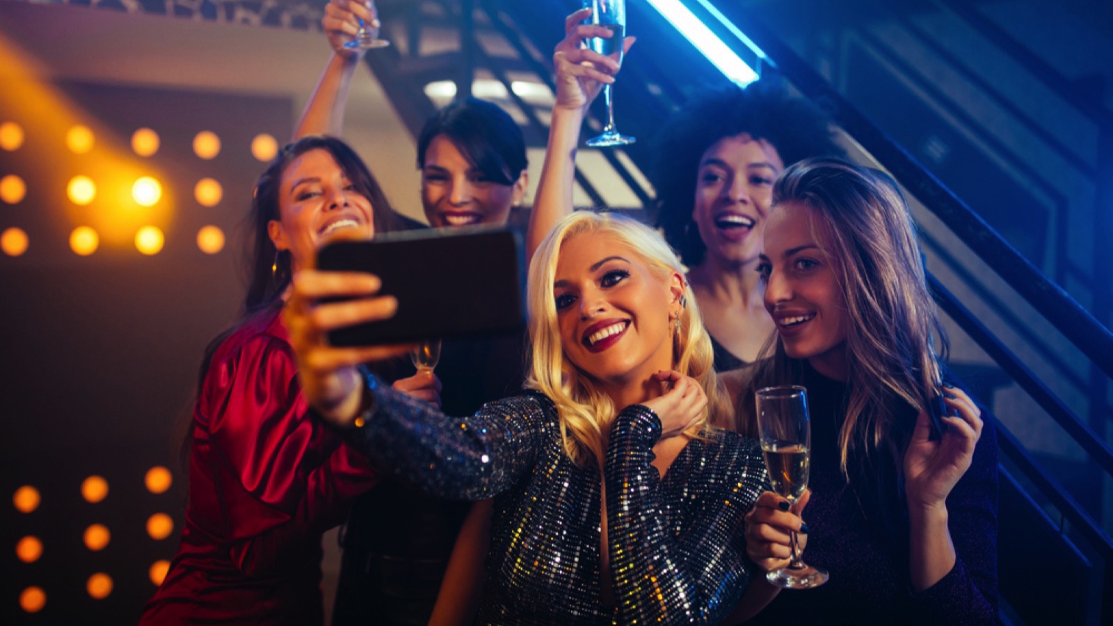 15 Things Even Broke People Always Spend Money On 15 Girls enjoying taking selfie in night club