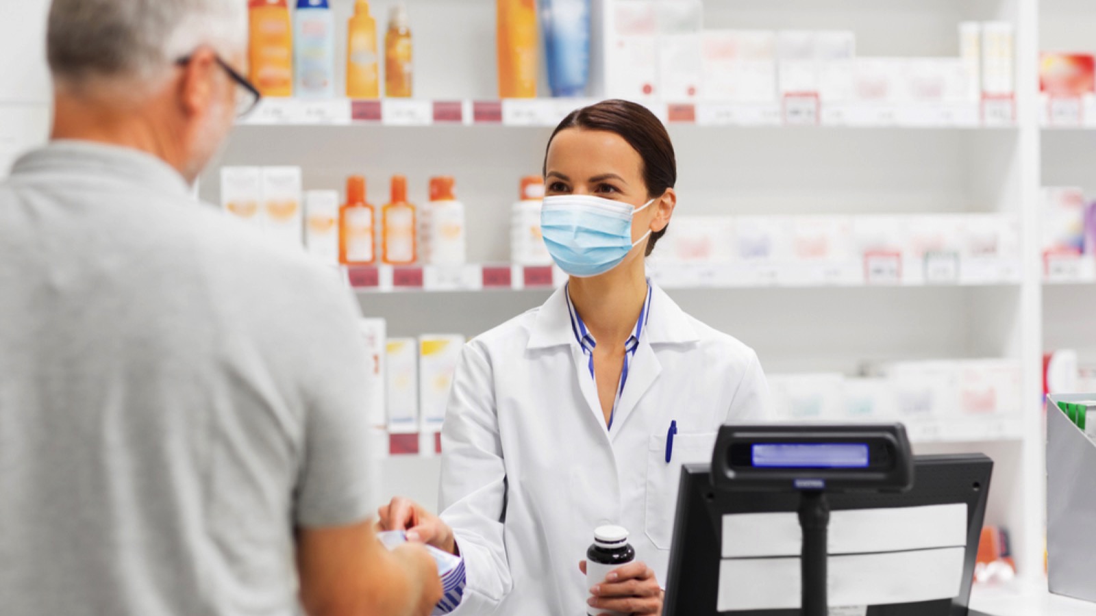 Old man buying medicines