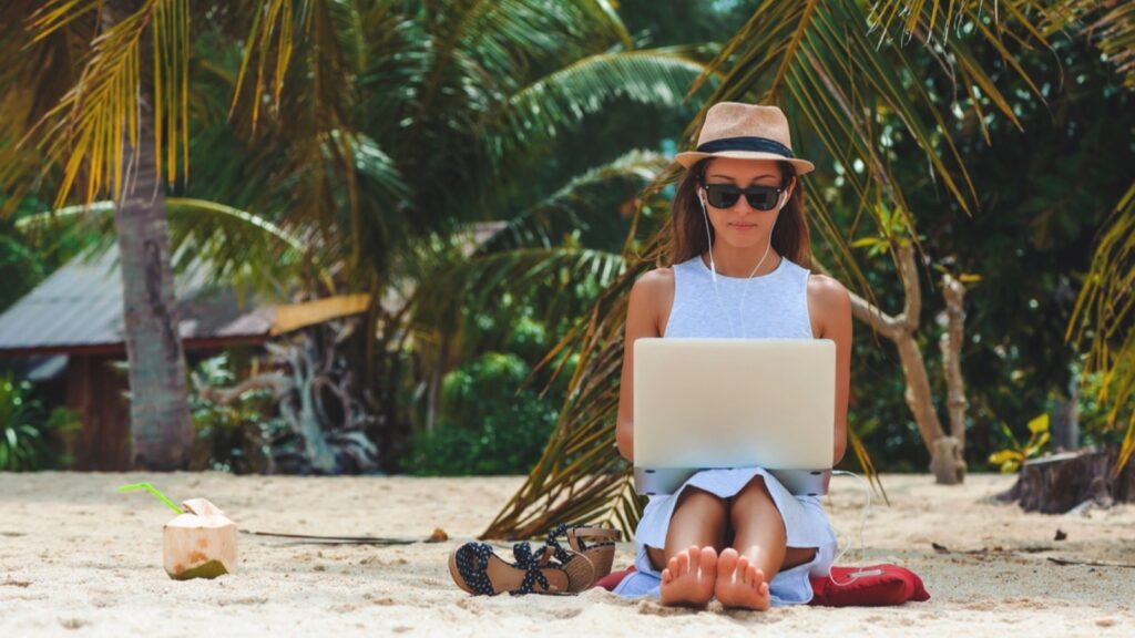 Attractive woman working in beach