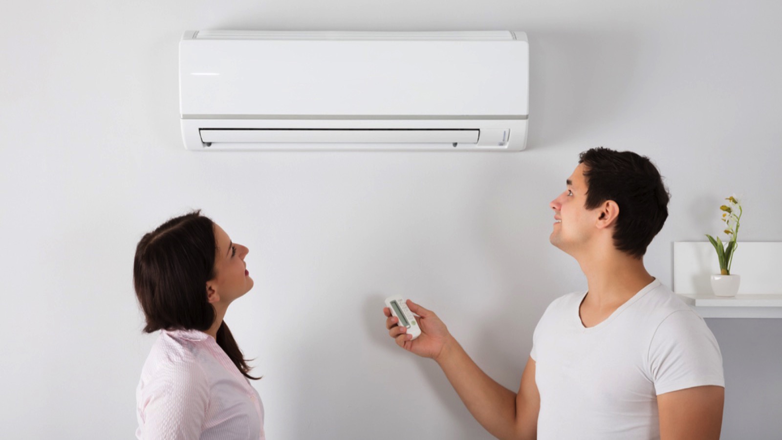 15 Suspiciously Easy Ways to Lower Your Electric Bill 11 Couples switching off AC