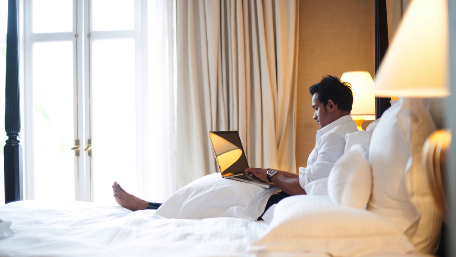 A New Car for Less Than $2,000? Here Is How Much Everyday Items Cost in 1950 12 Man resting in hotel room