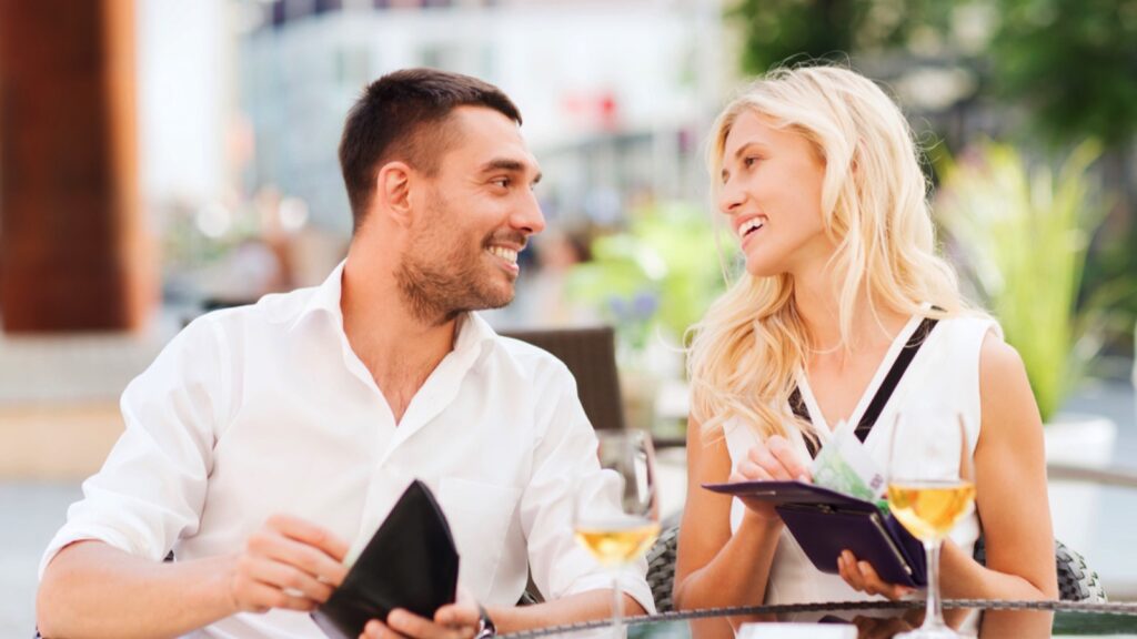 Paying bill in cash at restaurant