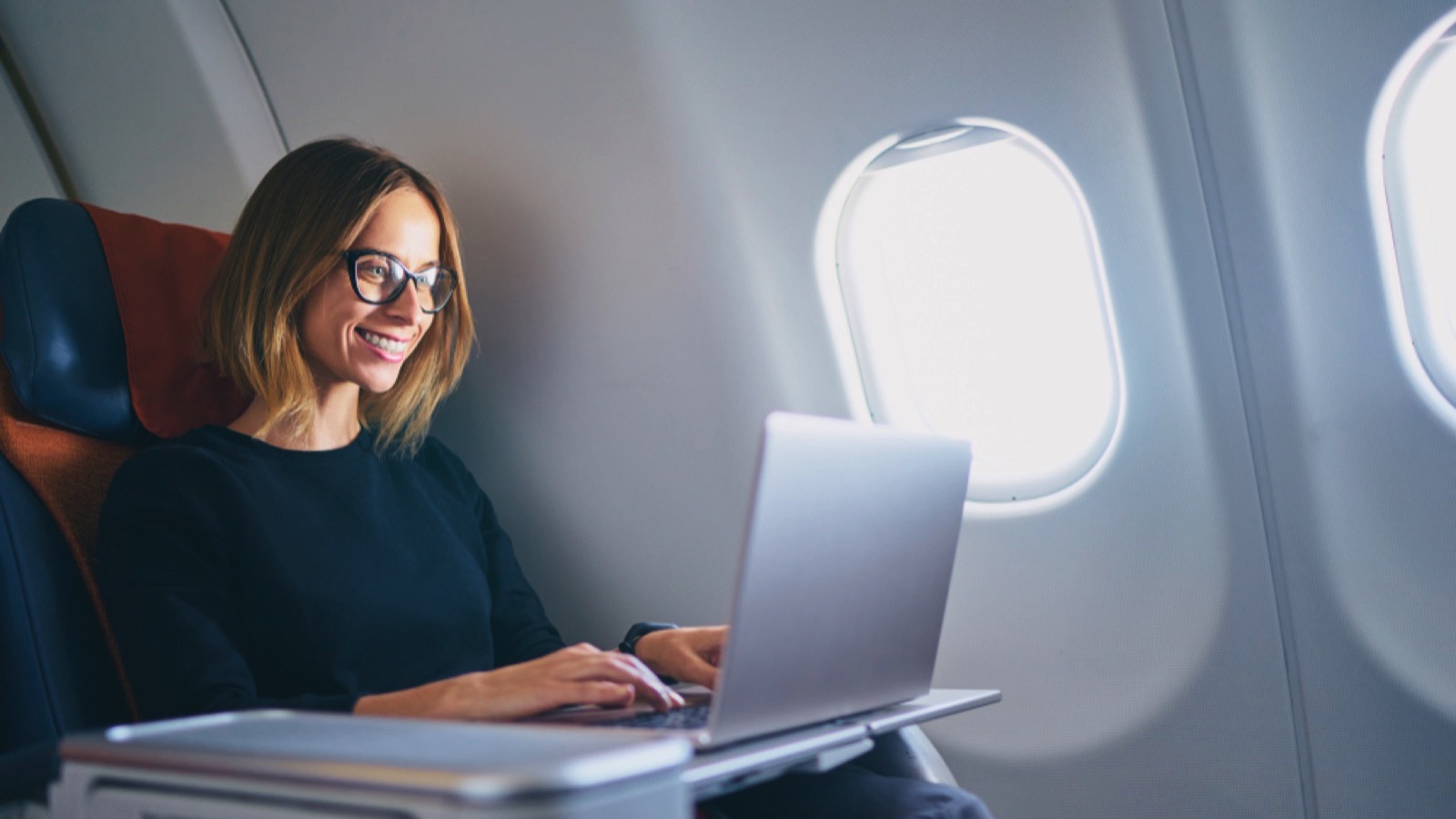 Woman traveling in first class