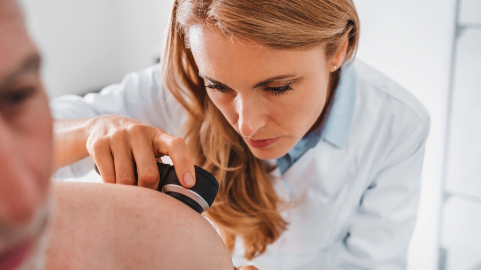 Doctor examines patient with device