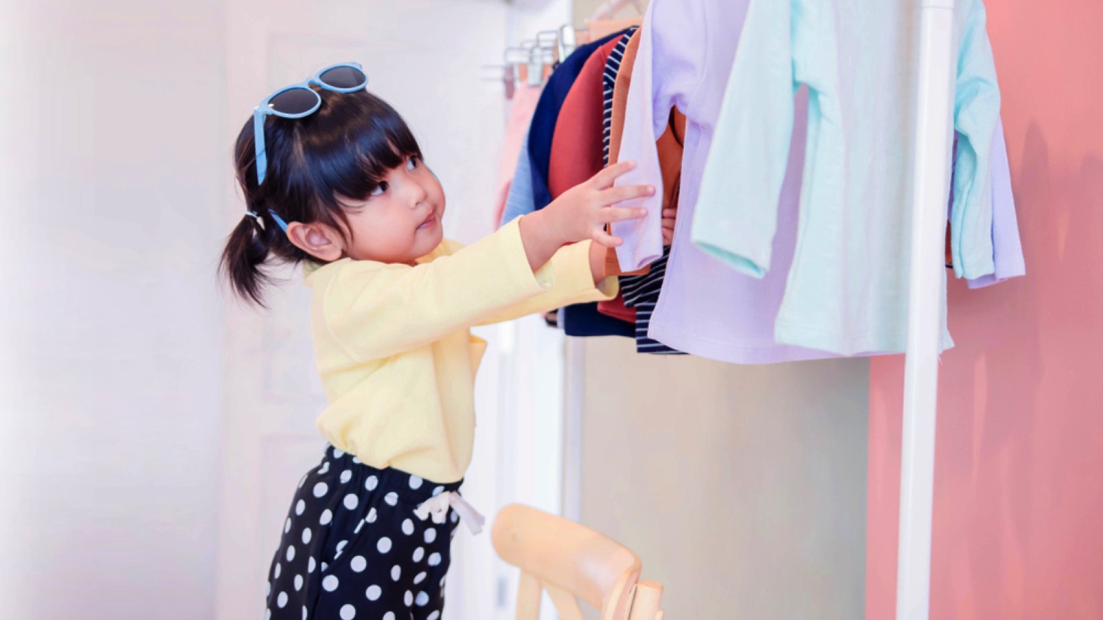 Kid selecting her dress