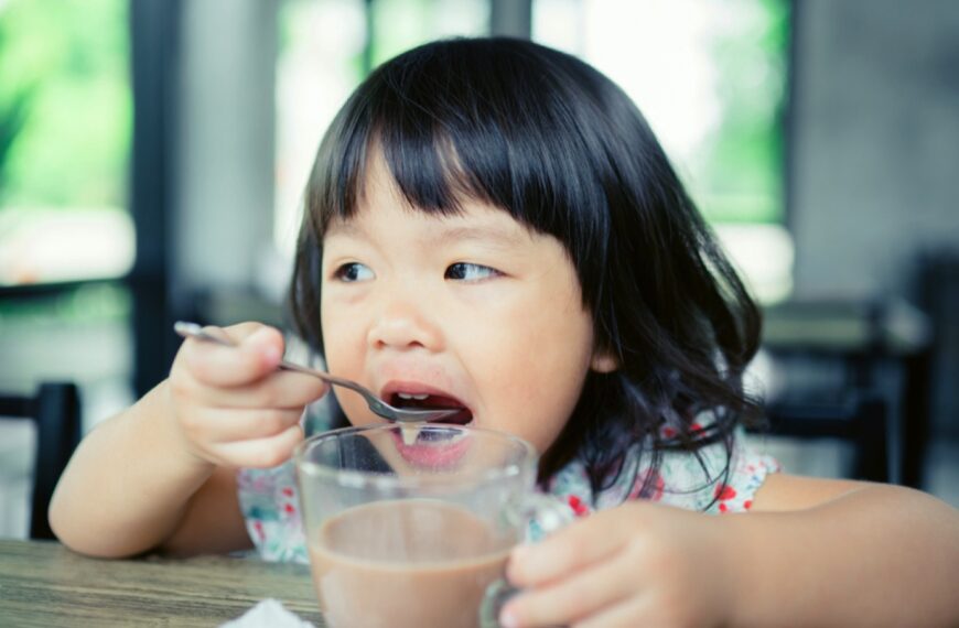 Wealthy Nickel 5 Little girl drinking chocolate milk