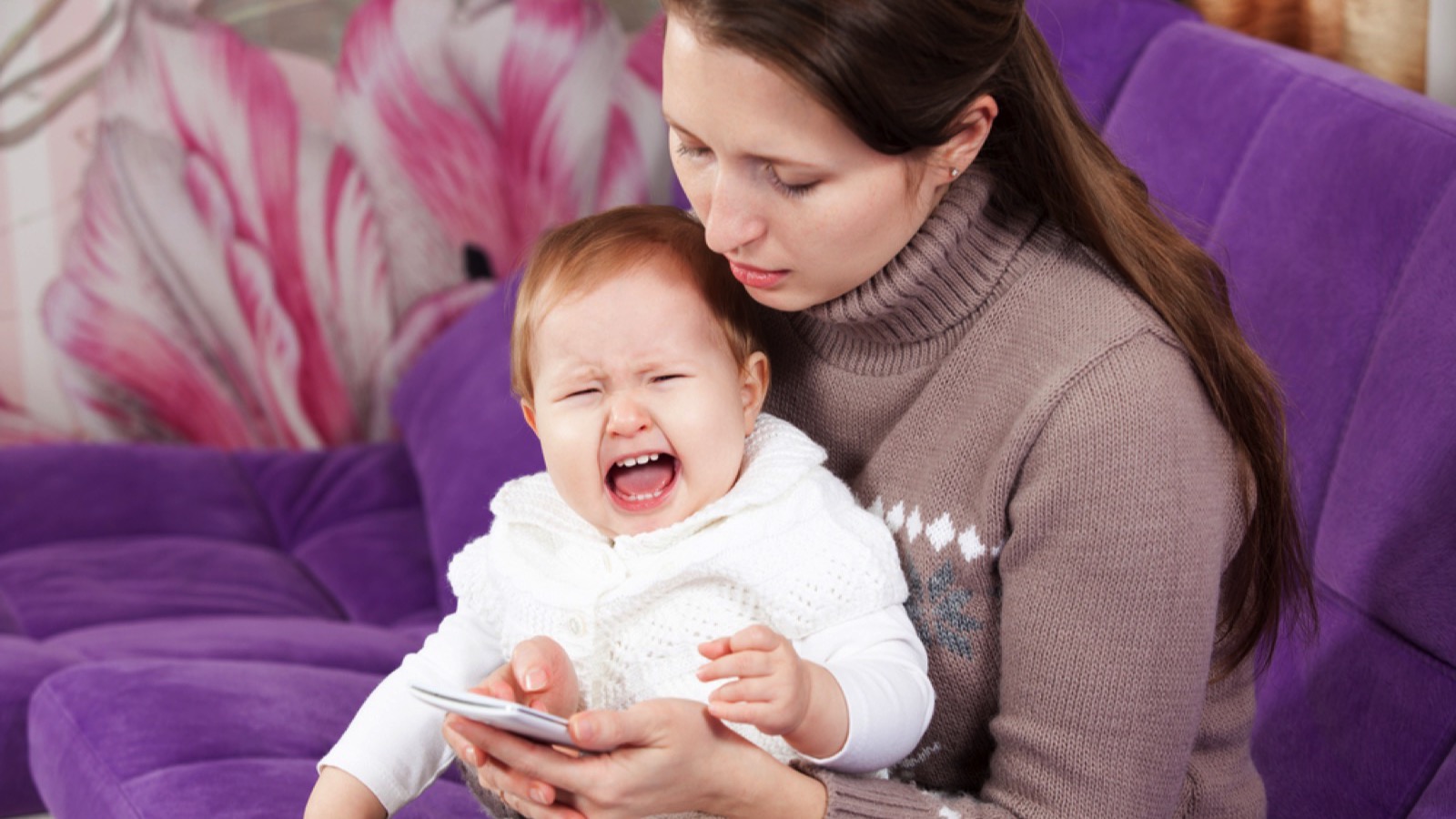 Mom ignoring crying baby
